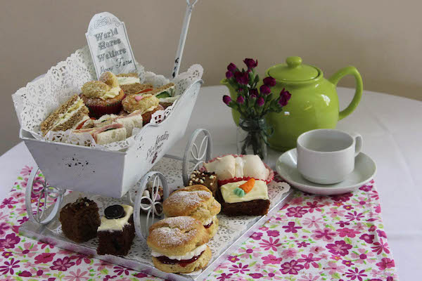 a display of cakes and tea